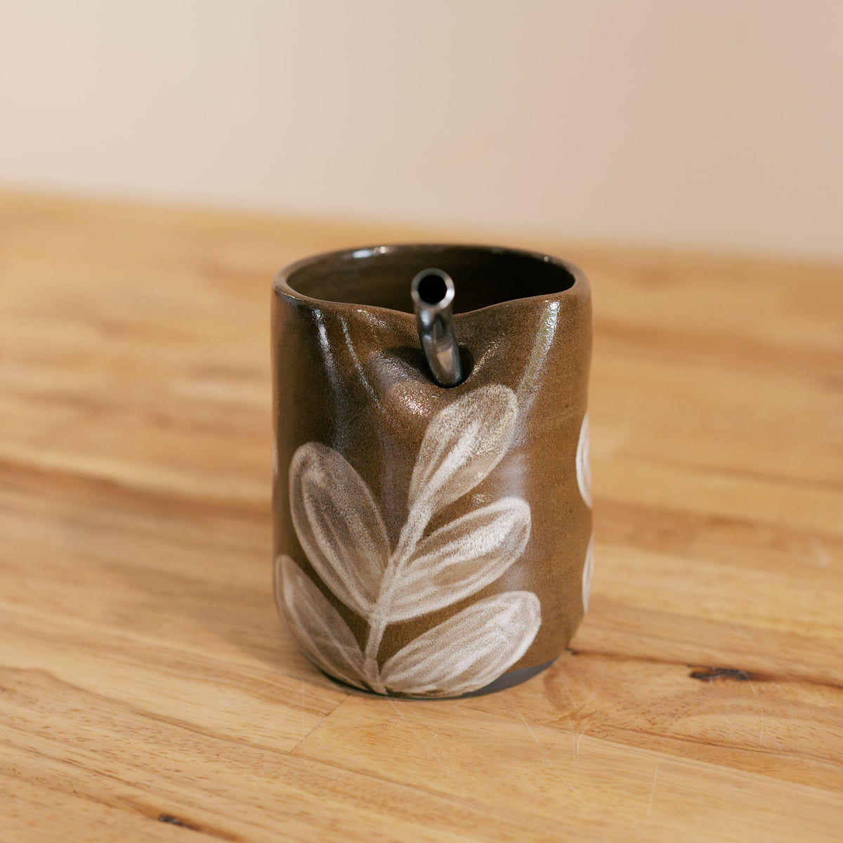 Brown and White Straw Cup